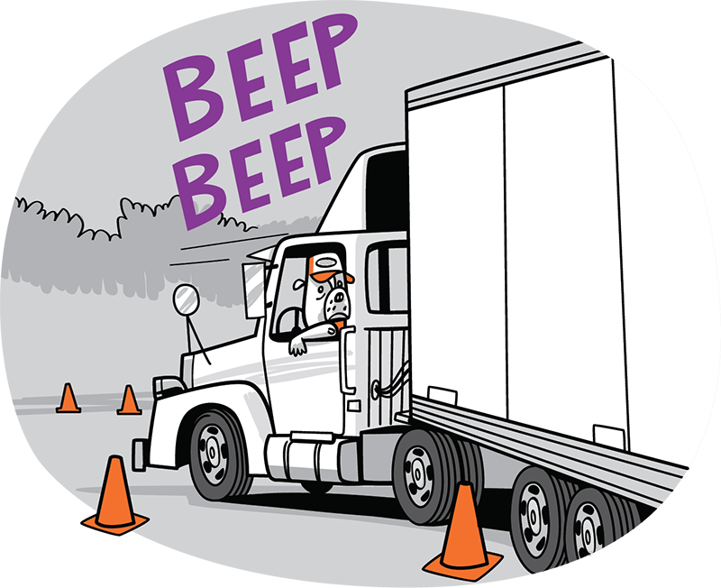 Dog driving a large truck in reverse